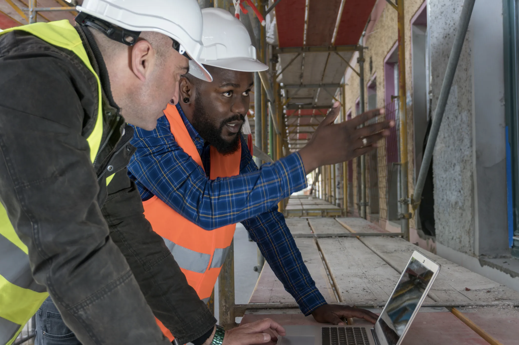 Construction workers conducting field inspection